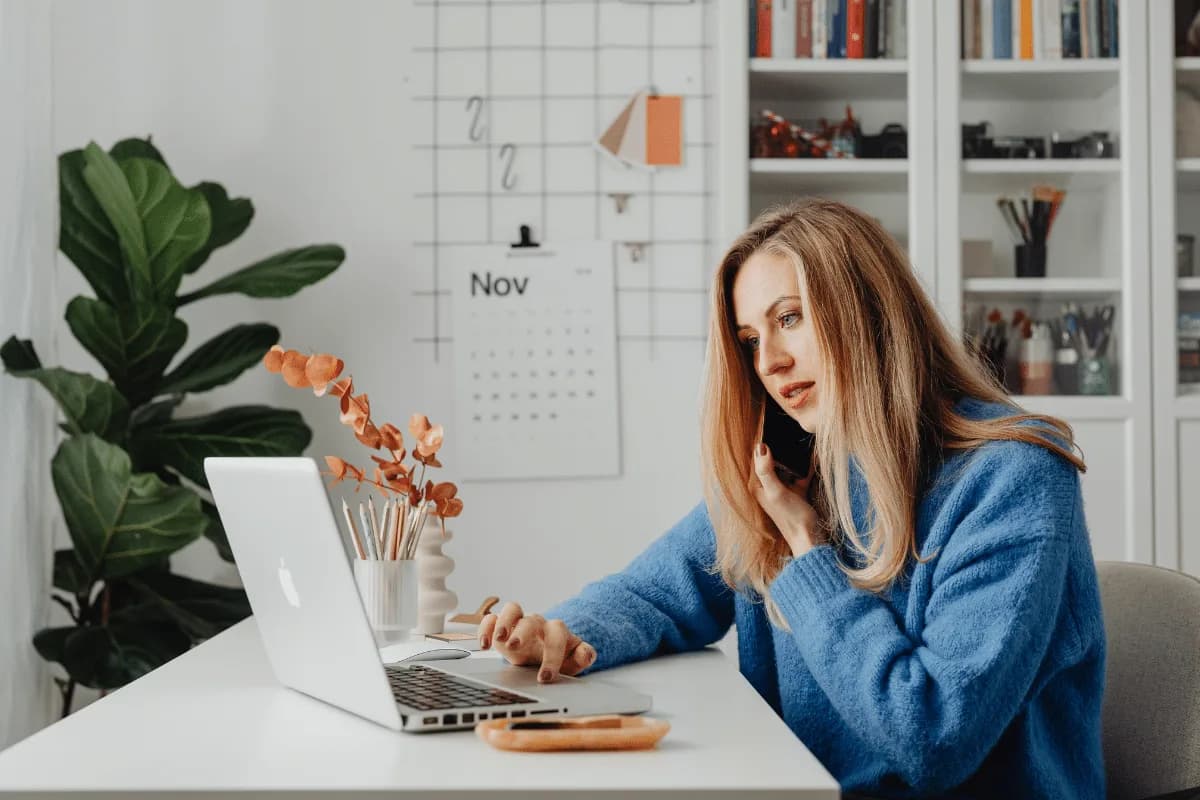 Business owner maintaining communication with their Virtual Assistant during Q4 busy season