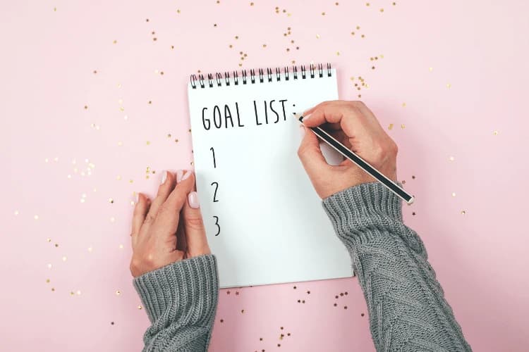 Entrepreneur overcoming goal achievement roadblocks with coaching and Virtual Assistant support