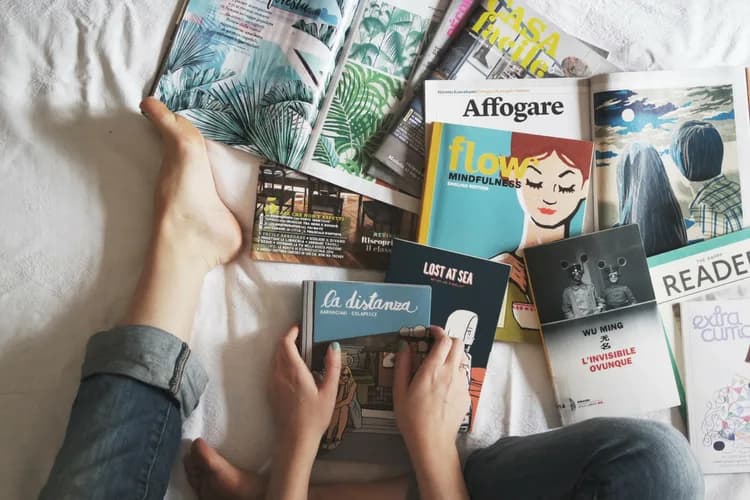 Entrepreneur reading business books for professional growth and creative inspiration