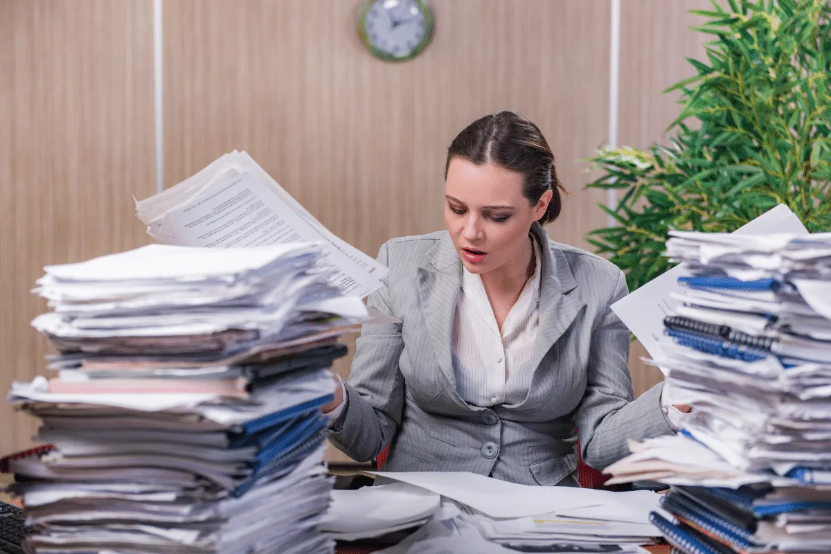 Entrepreneur scaling business sustainably with virtual assistant support to prevent burnout