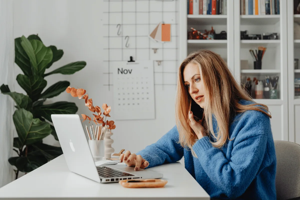 Business owner maintaining communication with their virtual assistant during Q4 busy season