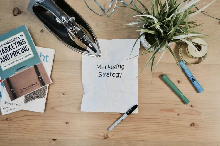 Entrepreneur developing blog, email, and social media marketing strategy for small business