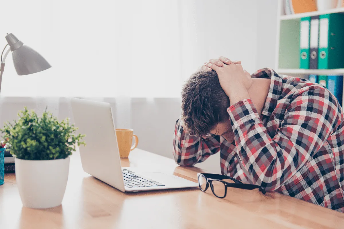 Business owner recognizing the signs they need to hire a virtual assistant for support