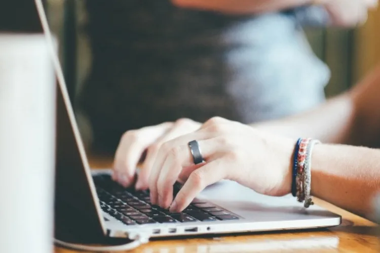 Marketer crafting engaging email newsletter with compelling subject lines and CTAs