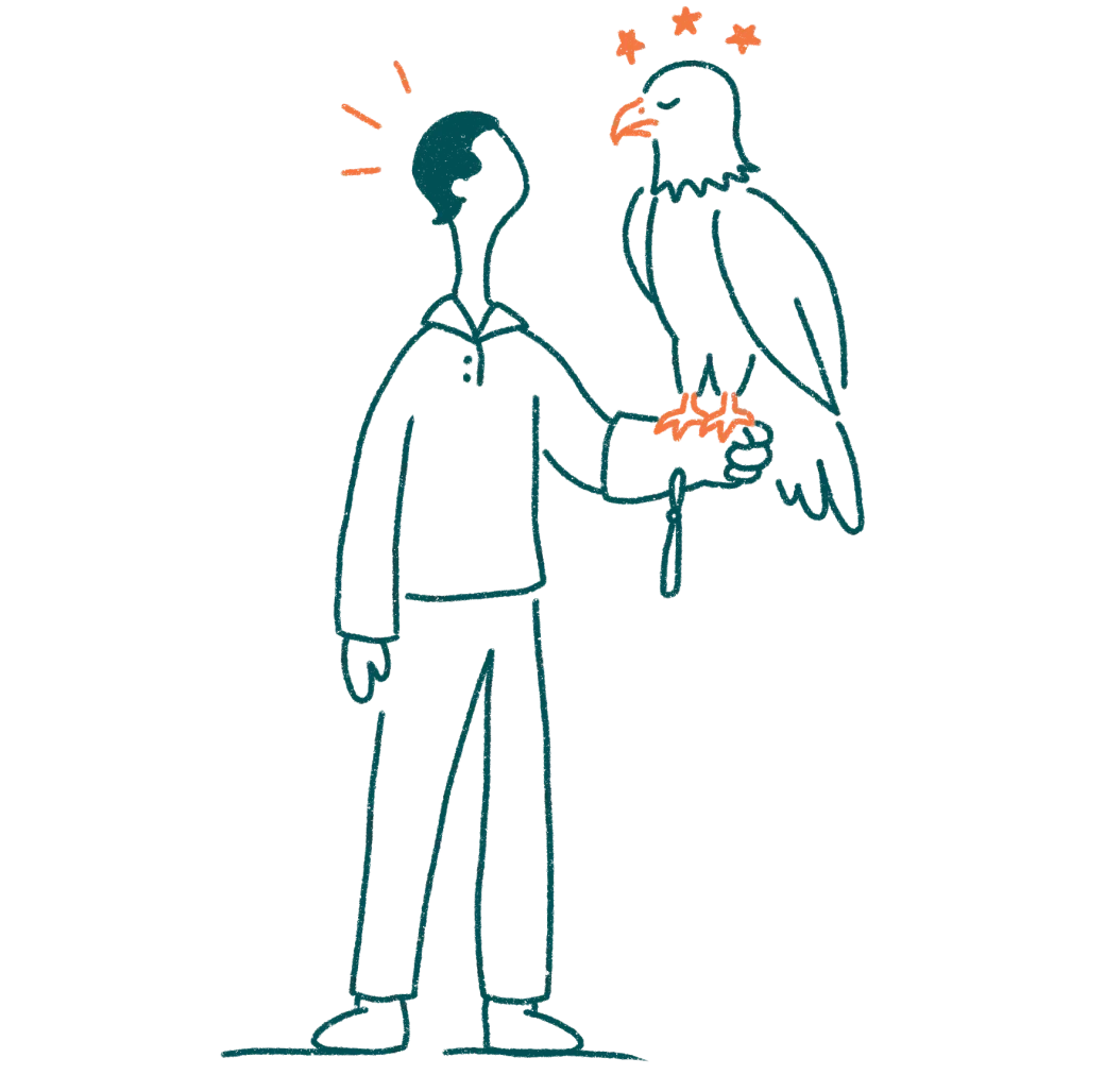 A person holding a bald eagle on their arm