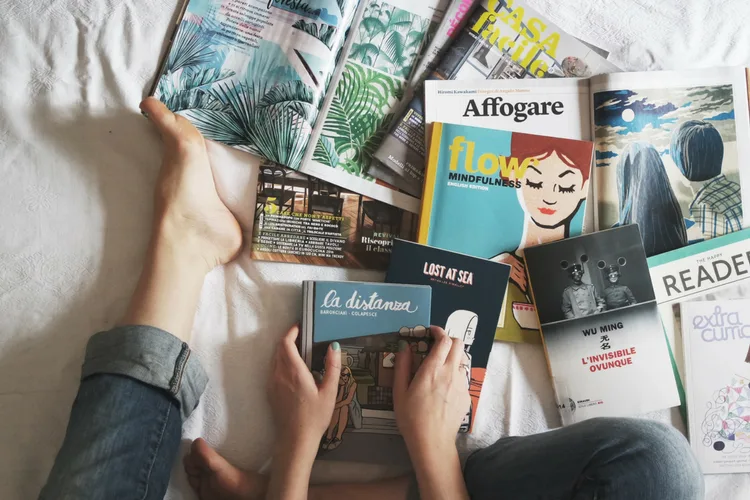 Entrepreneur reading business books for professional growth and creative inspiration